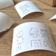 Illustration for article titled This Neural Network Instant Camera Turns Everything You Shoot Into Cartoon Doodles